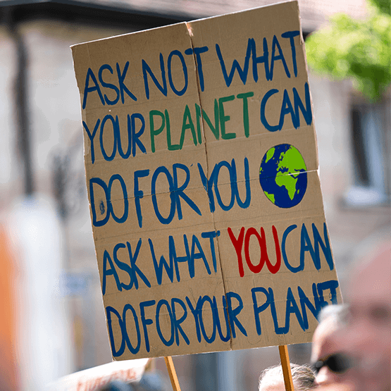 What you can do for your planet placard sign at climate change protest