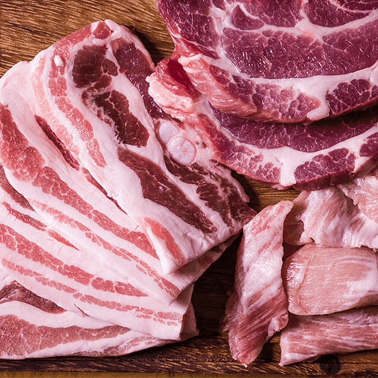 Raw meat on butchers block