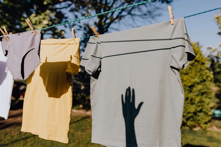 clothes airing on a washing line. Photo by Karolina Grabowska: https://www.pexels.com/photo/clothes-drying-on-rope-with-clothespins-in-garden-4495705/