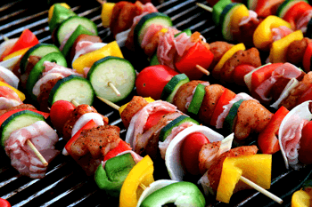 A range of food being cooked on the barbeque, portion planning helps to reduce food waste